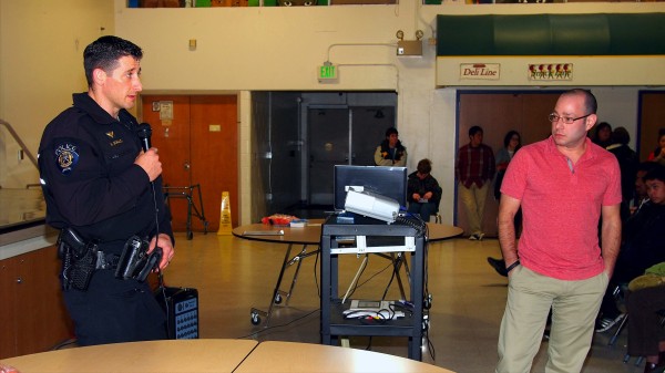 Jason and an officer from the Federal Way Police Dept. present to high school students for TADD.